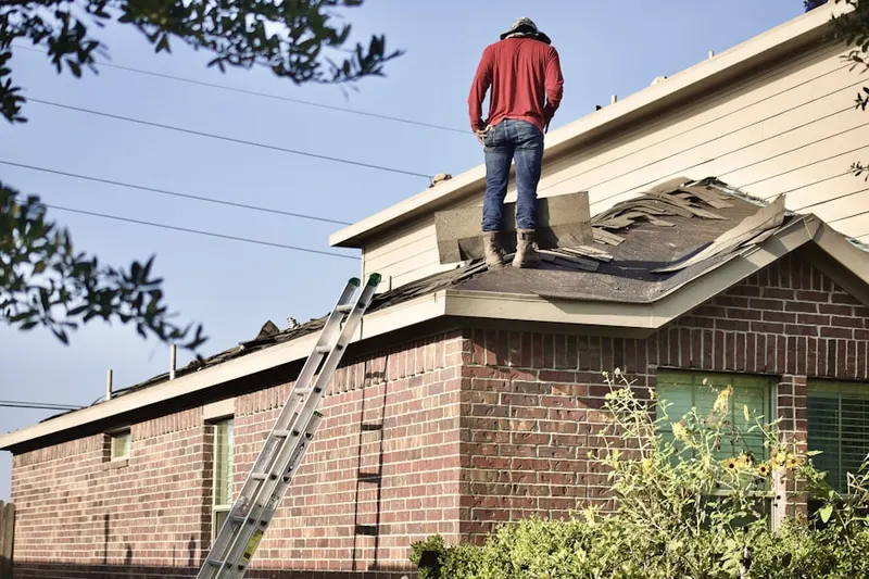 Professional roofer working on a residential roof in North Bethesda